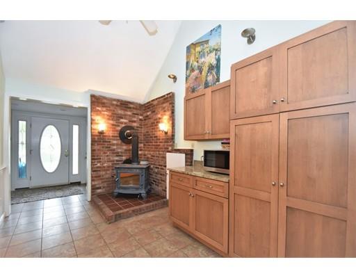 201 Cart Path Road Tewksbury, MA 01876 - Photo 10 of 29 a kitchen with white cabinets and white appliances