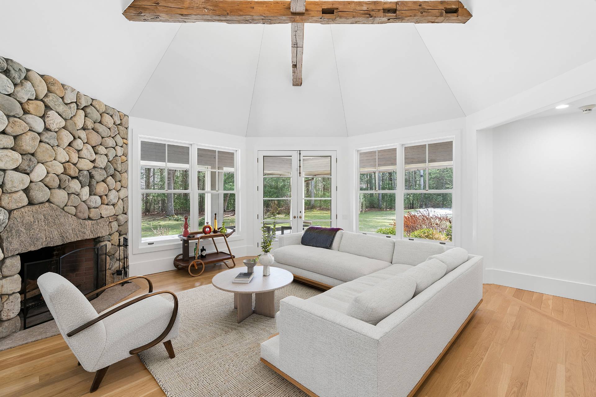 211 Swamp Road East Hampton, NY 11937 - Photo 7 of 23 a living room with furniture and a fireplace