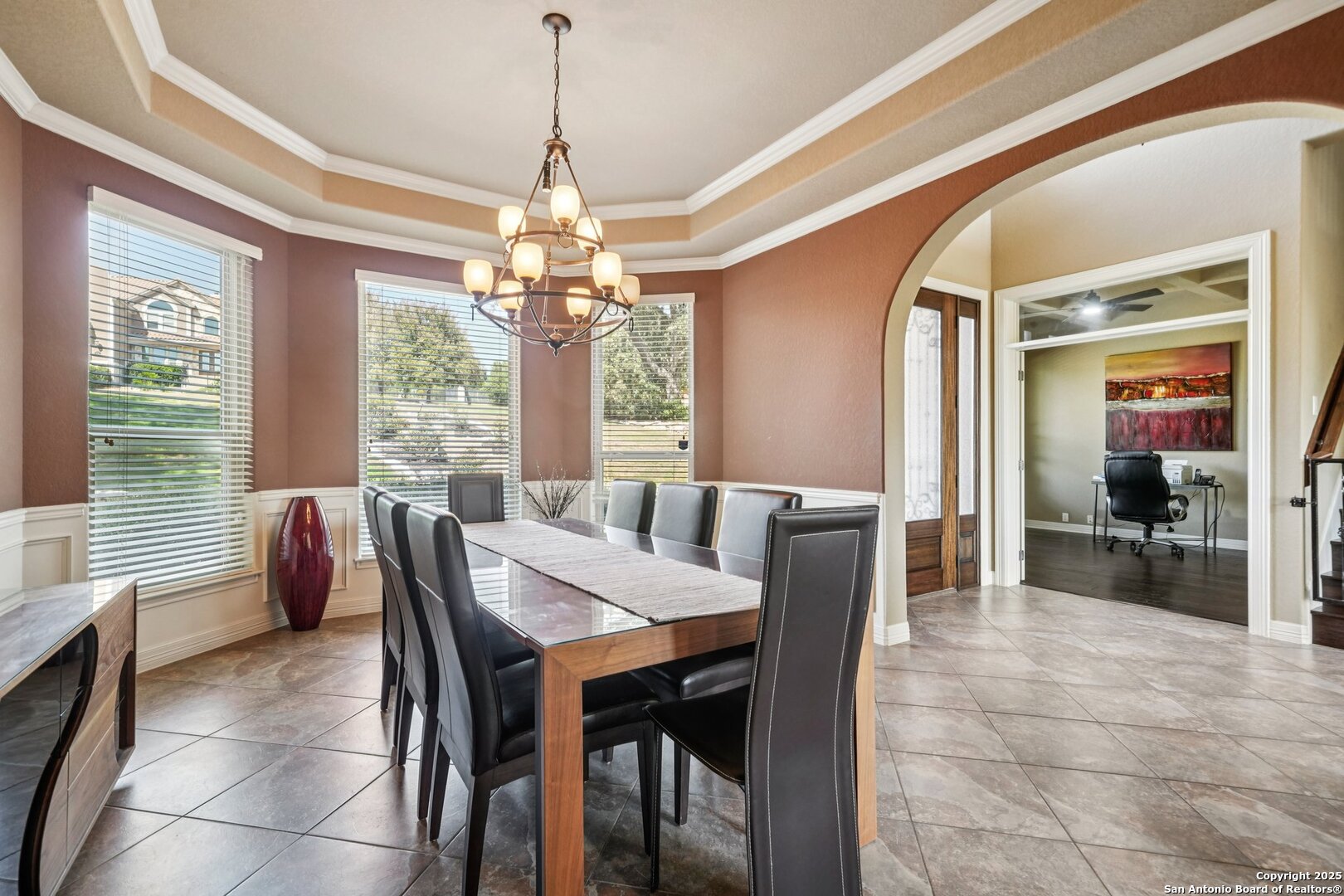 718 Ruidosa Downs Helotes, TX 78023 - Photo 19 of 50 a dining room with furniture a chandelier and a rug