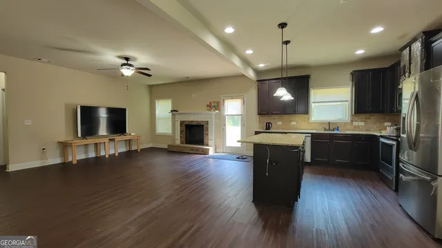 a view of kitchen with cabinets and wooden floor