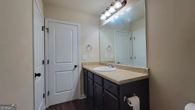 a bathroom with a sink and a mirror