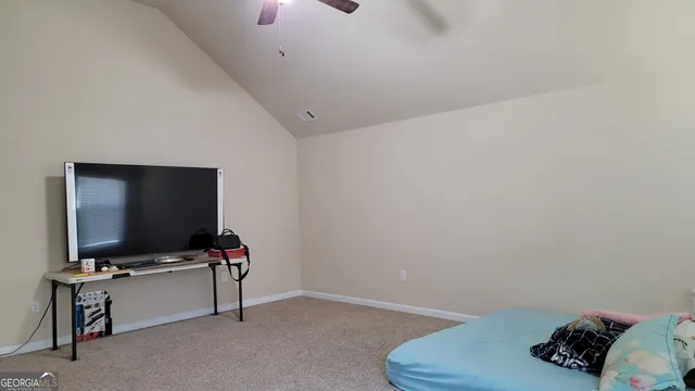 a room that has a bed and a window