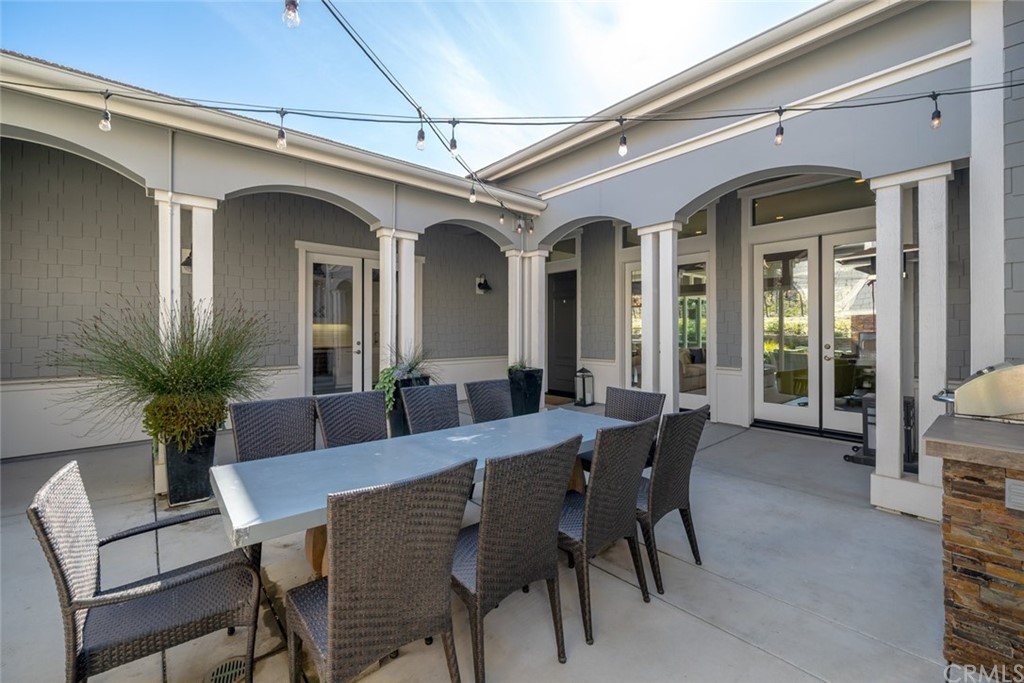 1481 Mesa Road Nipomo, CA 93444 - Photo 14 of 74 a view of a dining room with furniture and a potted plant