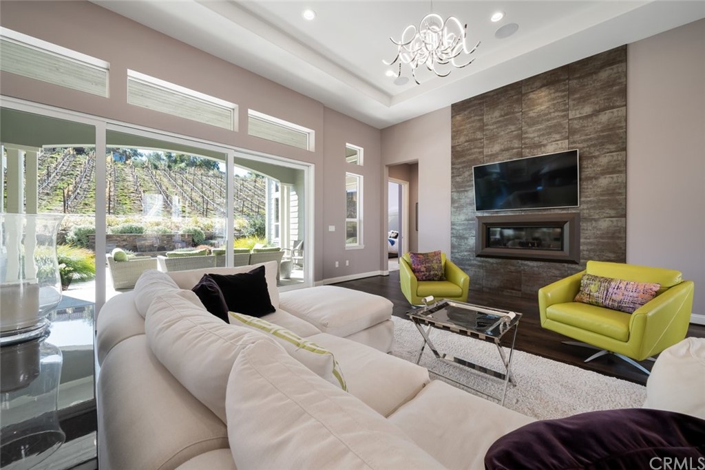 1481 Mesa Road Nipomo, CA 93444 - Photo 15 of 74 a living room with furniture a flat screen tv and a large window