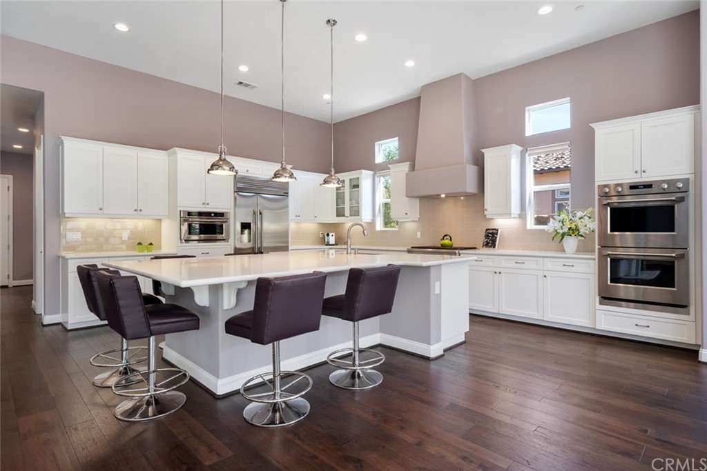 1481 Mesa Road Nipomo, CA 93444 - Photo 22 of 74 a large kitchen with cabinets wooden floor stainless steel appliances and cabinets