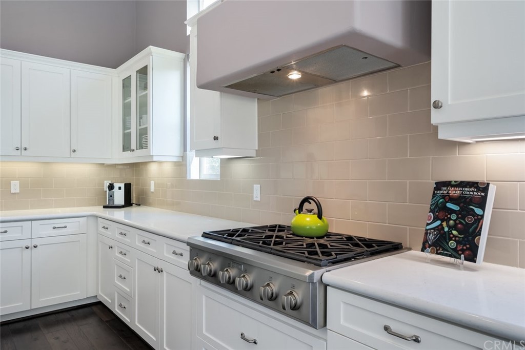1481 Mesa Road Nipomo, CA 93444 - Photo 24 of 74 a kitchen with a stove and white cabinets