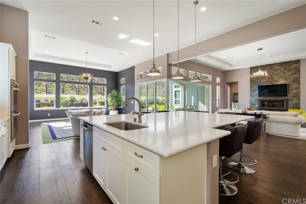 1481 Mesa Road Nipomo, CA 93444 - Photo 26 of 74 a kitchen with counter top space sink stove and wooden floor