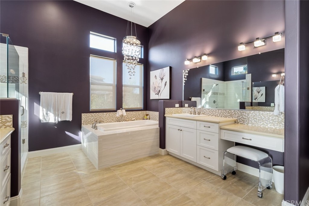 1481 Mesa Road Nipomo, CA 93444 - Photo 30 of 74 a bathroom with a granite countertop sink a large mirror and a bathtub