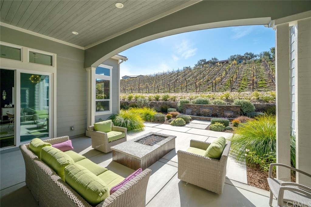 1481 Mesa Road Nipomo, CA 93444 - Photo 51 of 74 a living room with patio furniture and a floor to ceiling window