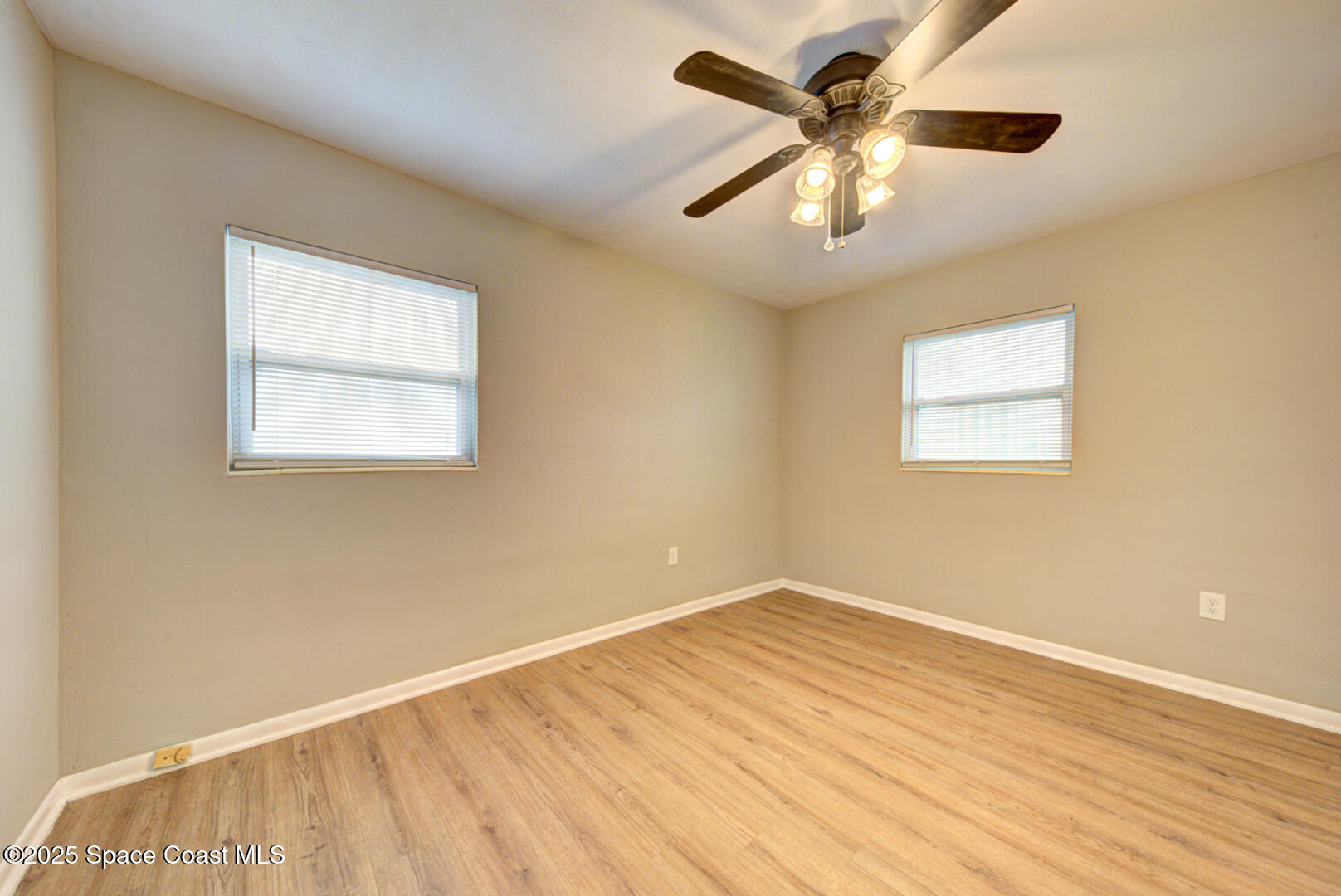 813 7th Street Merritt Island, FL 32953 - Photo 11 of 28 a view of an empty room with a window