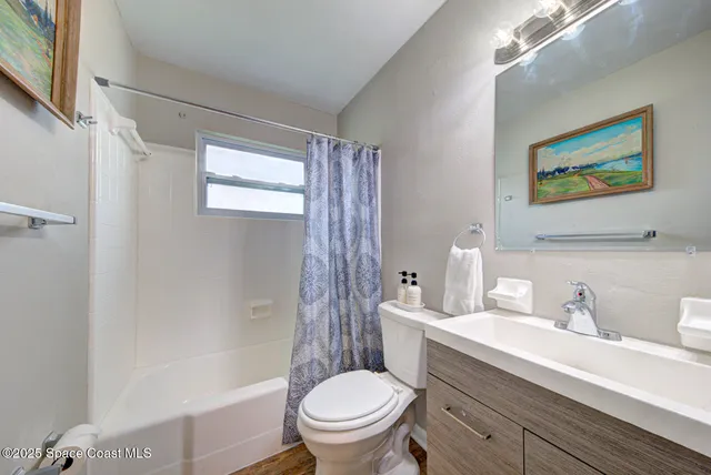 a bathroom with a toilet a sink and a bathtub