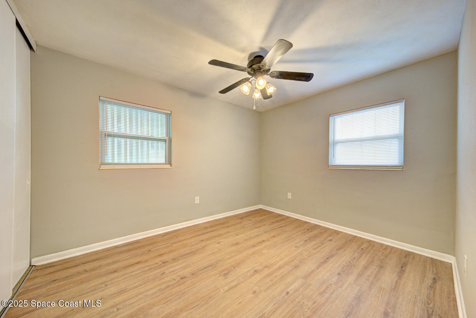813 7th Street Merritt Island, FL 32953 - Photo 15 of 28 a view of empty room with wooden floor