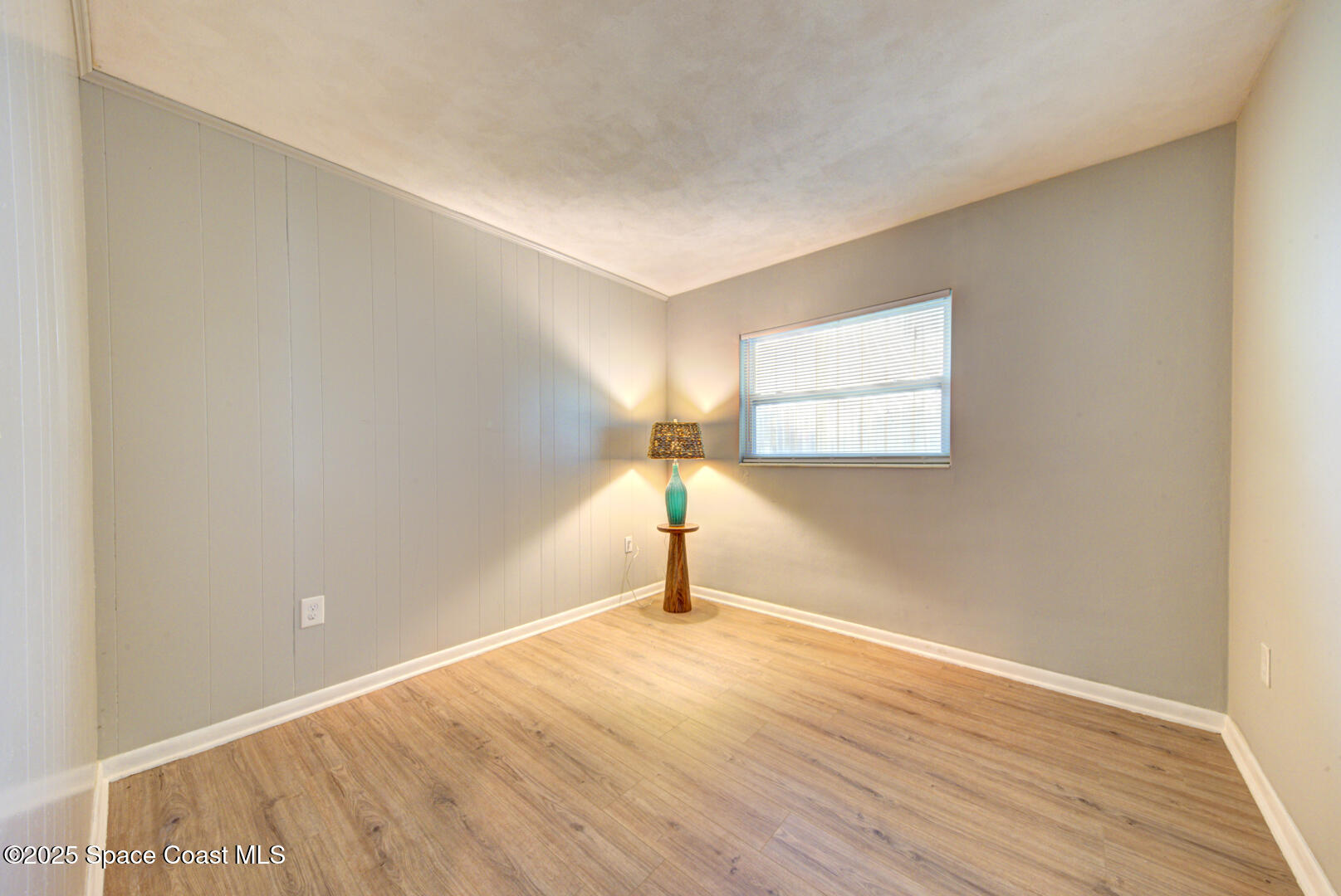 813 7th Street Merritt Island, FL 32953 - Photo 17 of 28 a view of a room with wooden floor