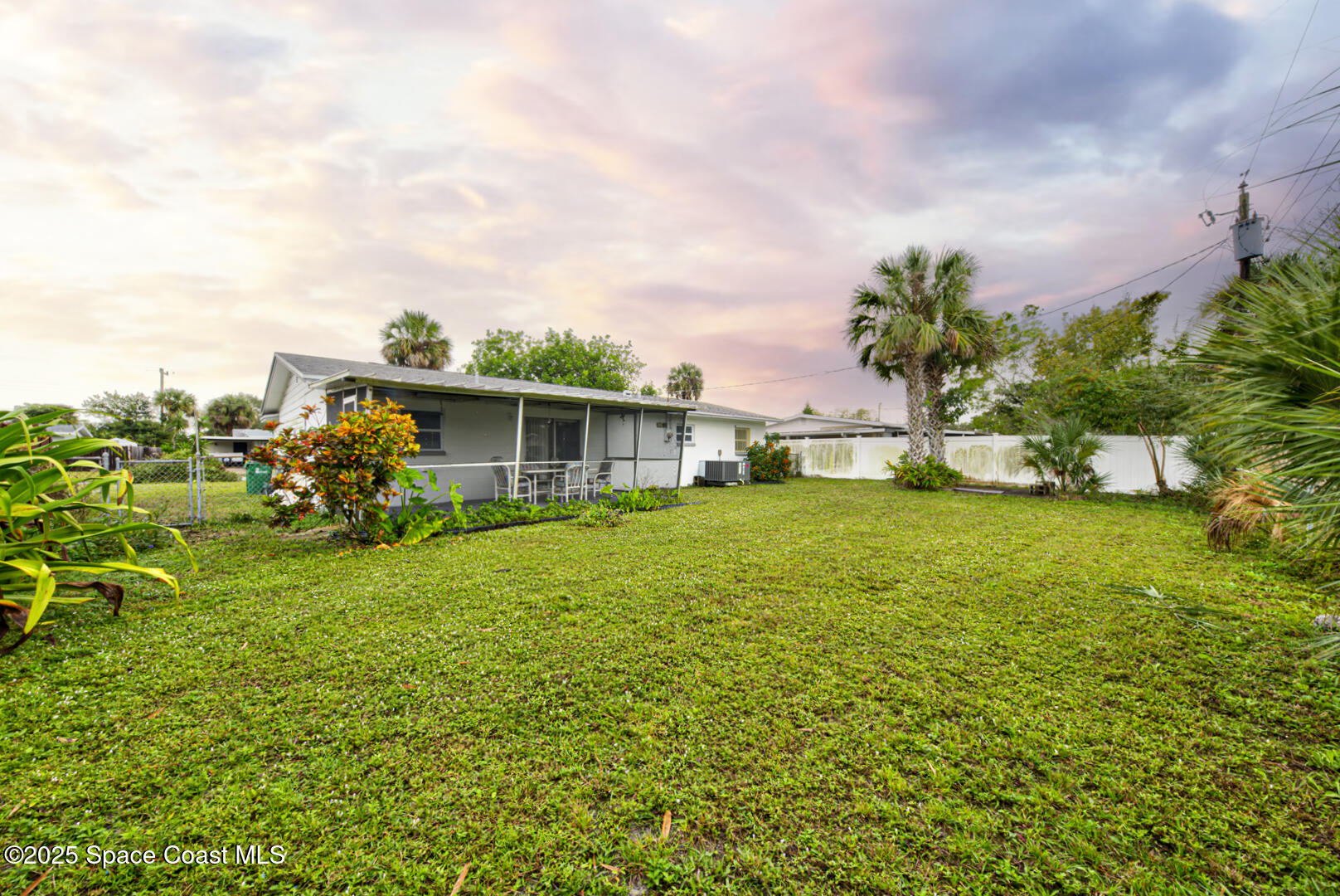 813 7th Street Merritt Island, FL 32953 - Photo 22 of 28 a front view of a house with garden