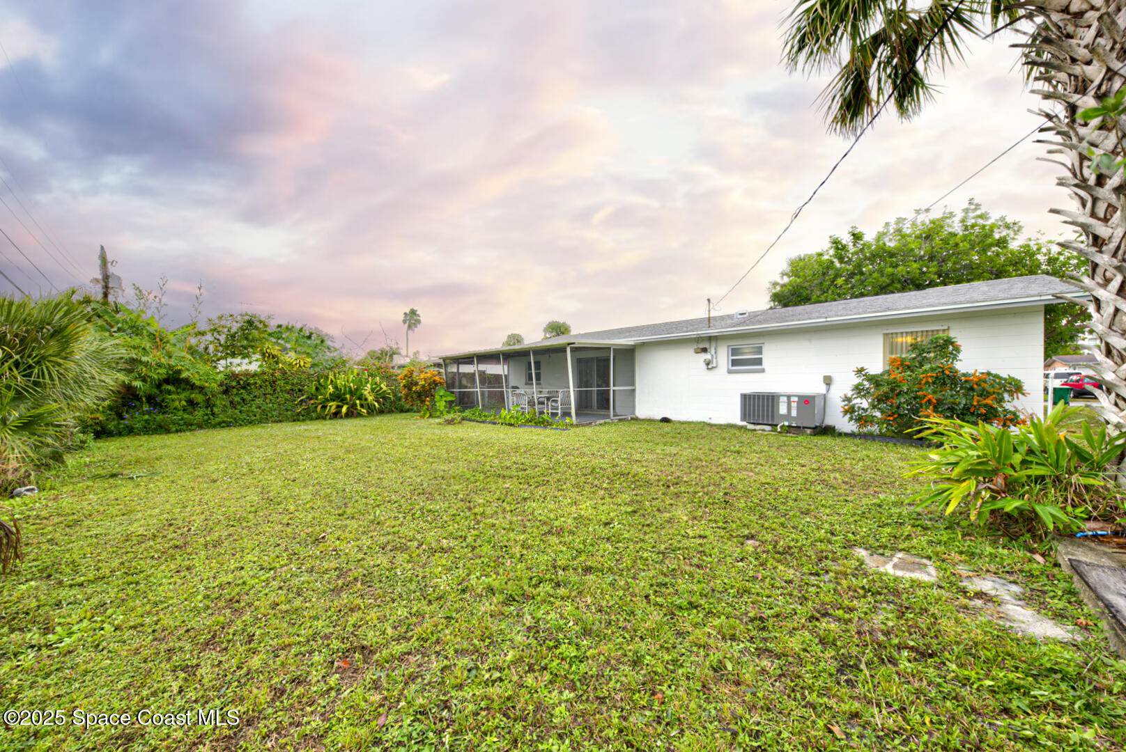 813 7th Street Merritt Island, FL 32953 - Photo 23 of 28 a front view of house with yard and green space