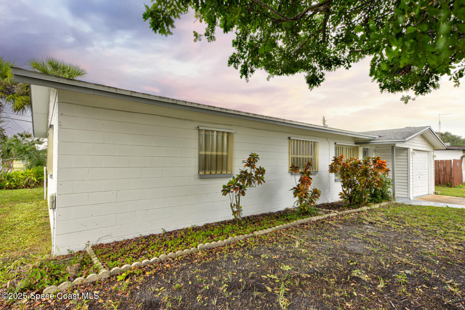 813 7th Street Merritt Island, FL 32953 - Photo 26 of 28 a front view of a house with a yard