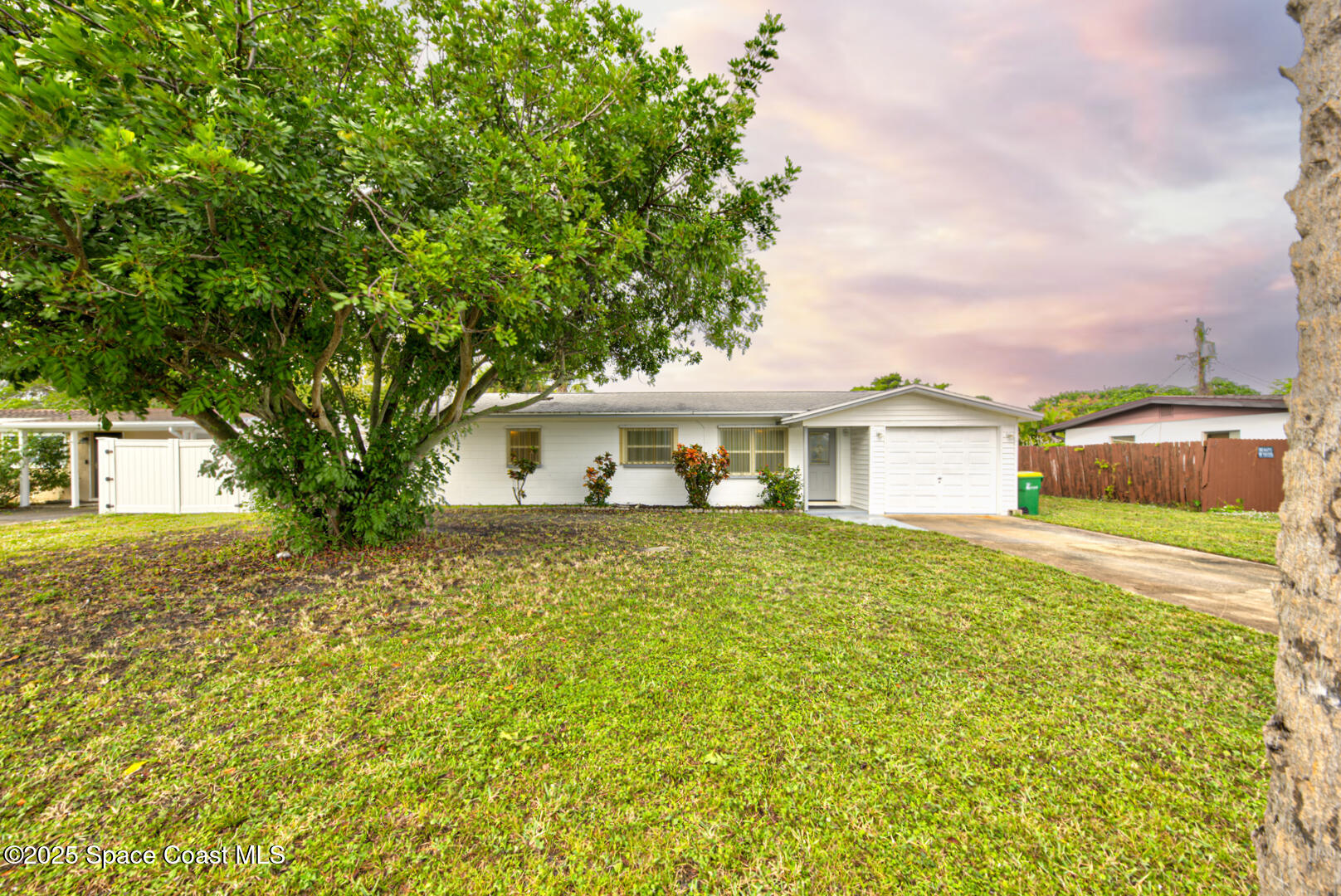 813 7th Street Merritt Island, FL 32953 - Photo 27 of 28 a front view of a house with a yard