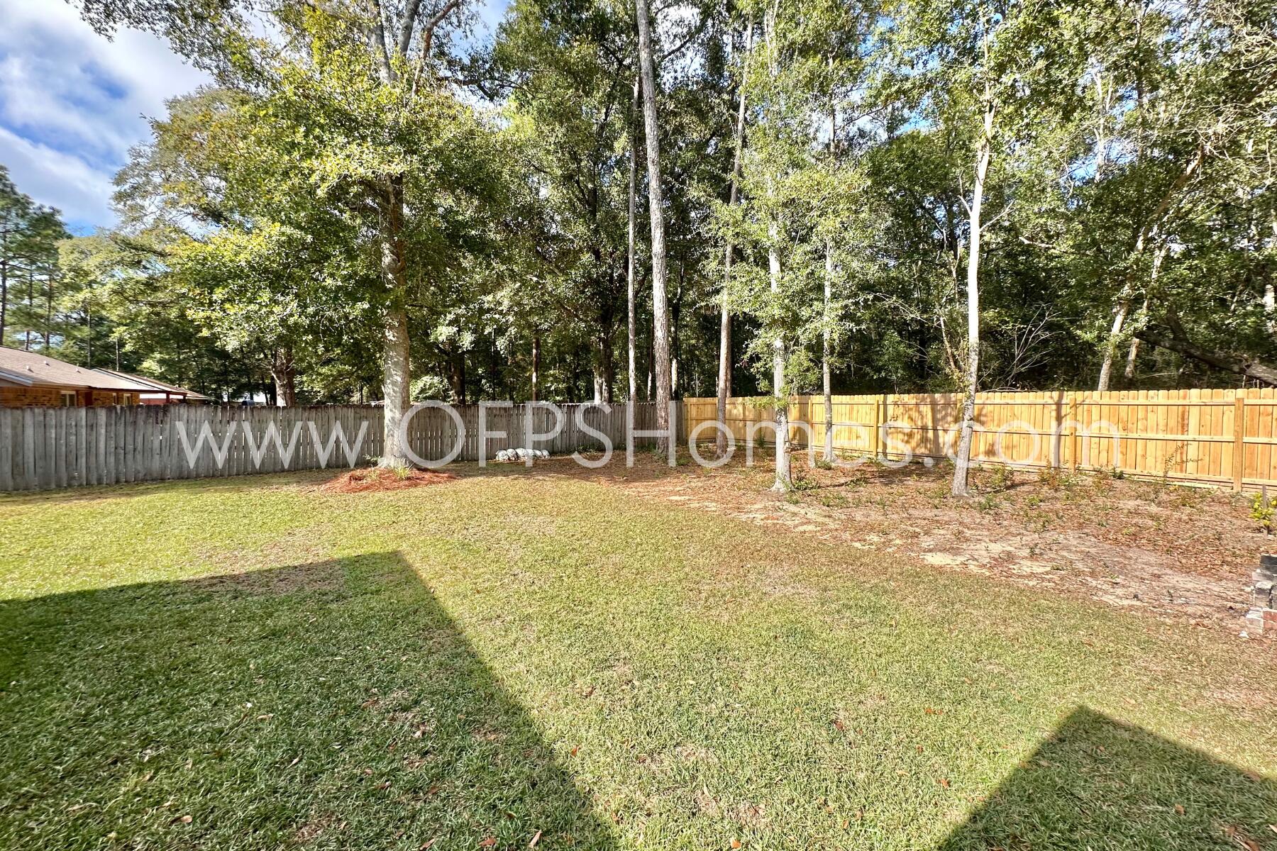 6762 Trailride North Milton, FL 32570 - Photo 24 of 25 a view of a yard with swimming pool