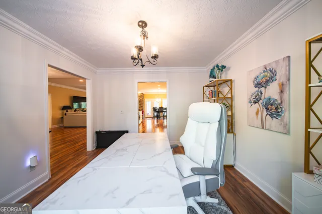 a view of a livingroom with furniture and wooden floor
