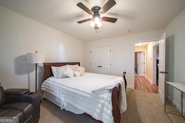 a bed room with a bed and a couch