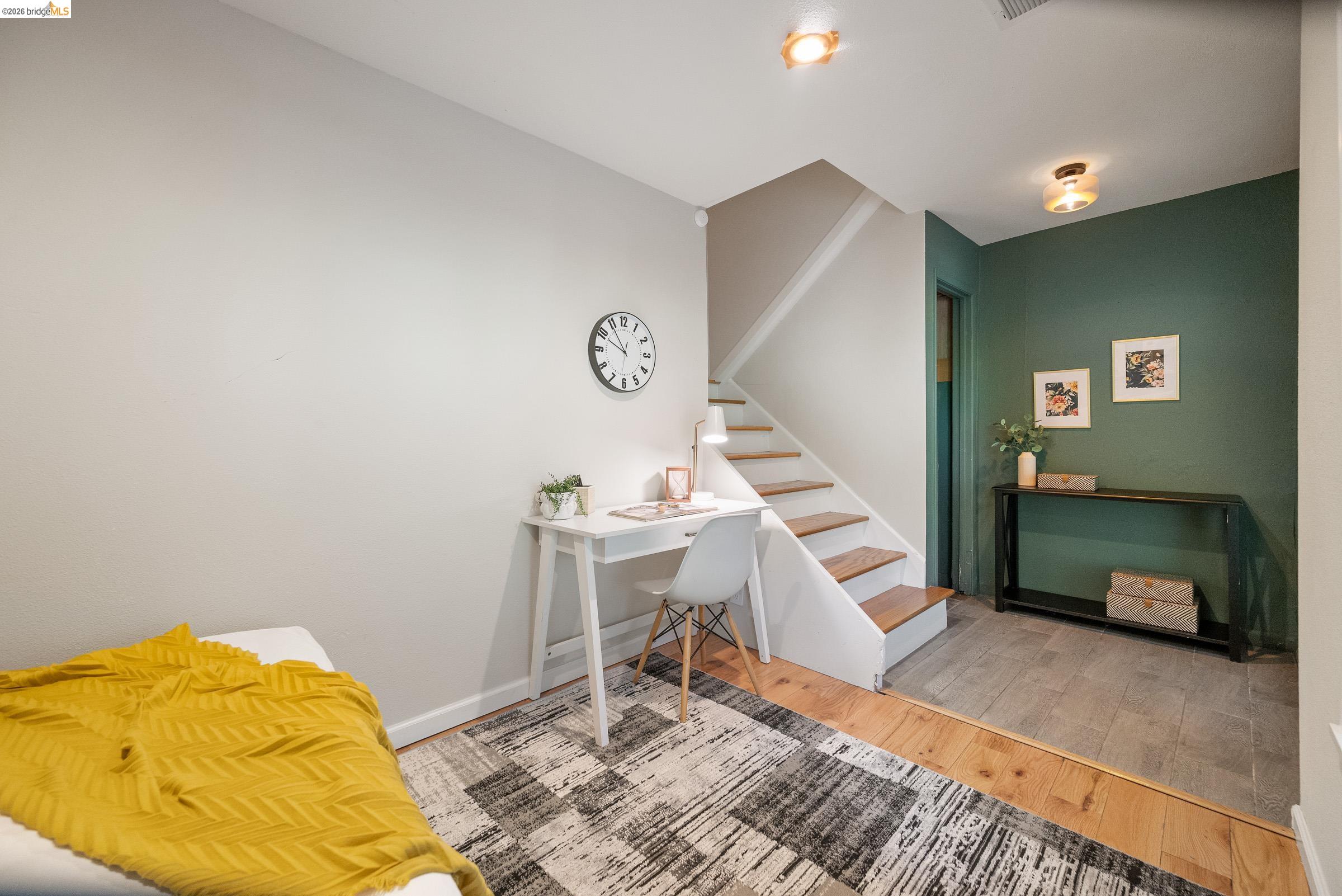 6600 Heather Ridge Way Oakland, CA 94611 - Photo 51 of 66 Open concept area featuring wood-finish flooring, a contemporary staircase with wood treads, and recessed lighting