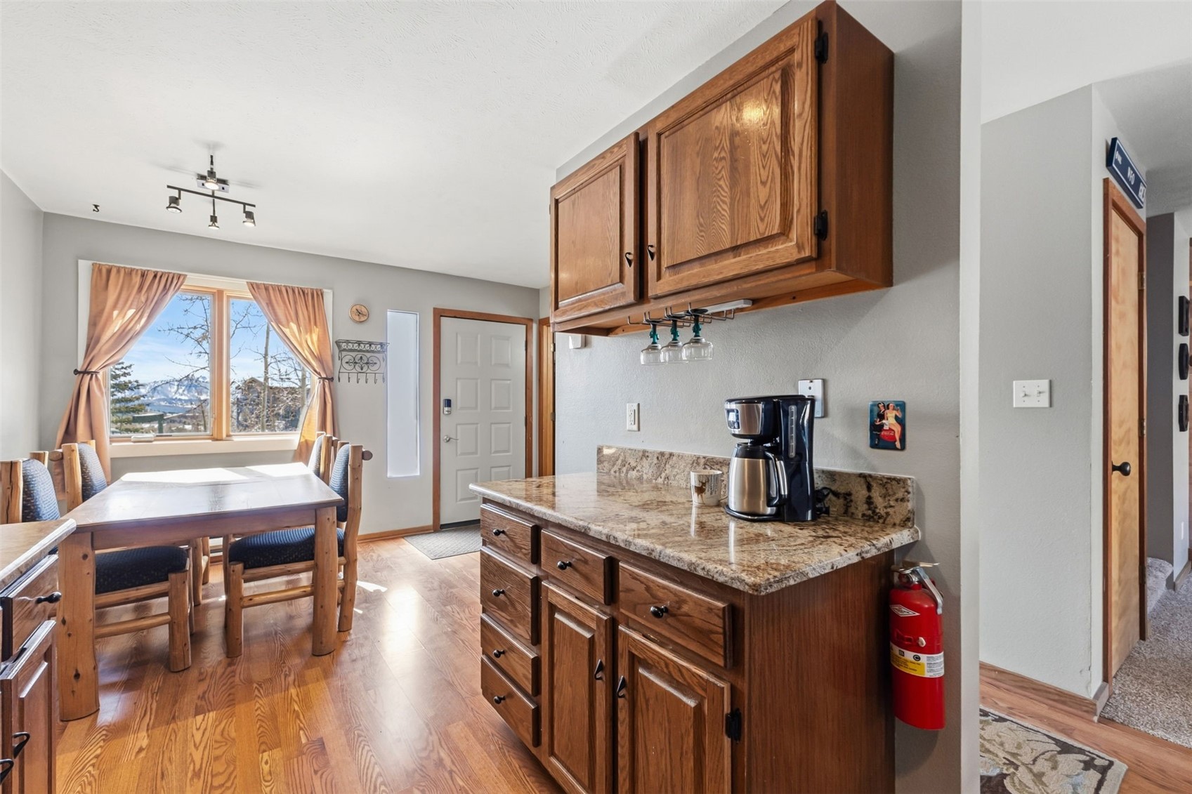 6734 Ryan Gulch Road, Unit 6734 Silverthorne, CO 80498 - Photo 13 of 33 a kitchen with stainless steel appliances granite countertop a stove and cabinets