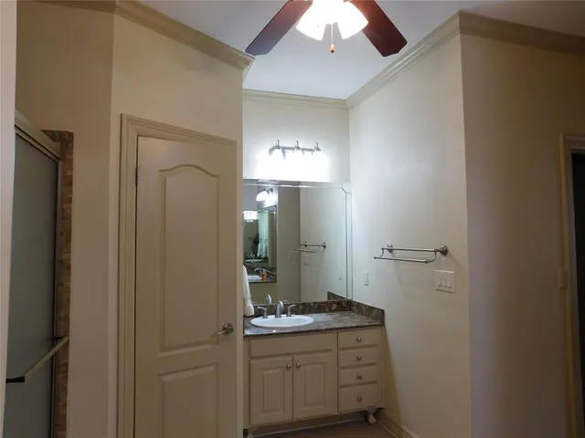 a bathroom with a glass shower door