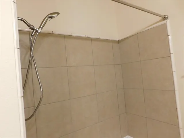 a bathroom with a light fixture and a mirror