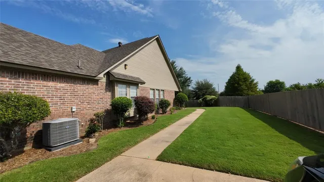 a house view with a garden space