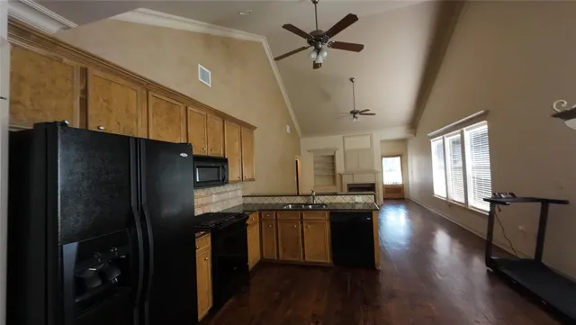 a view of a house with backyard and porch