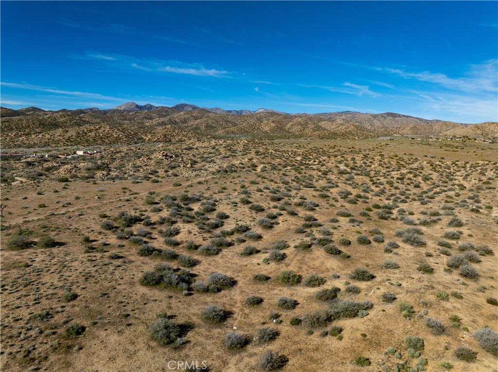 51856 Trails End Road Pioneertown, CA 92268 - Photo 18 of 45 a view of a large mountain with mountains in the background