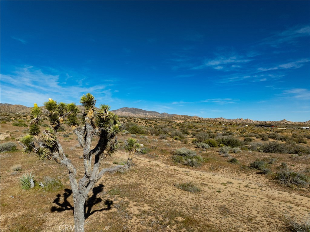 51856 Trails End Road Pioneertown, CA 92268 - Photo 27 of 45 a view of a large building with a mountain in the background