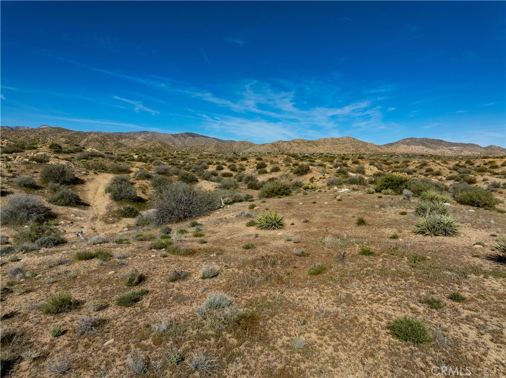 51856 Trails End Road Pioneertown, CA 92268 - Photo 30 of 45 a view of a large mountain with mountains in the background