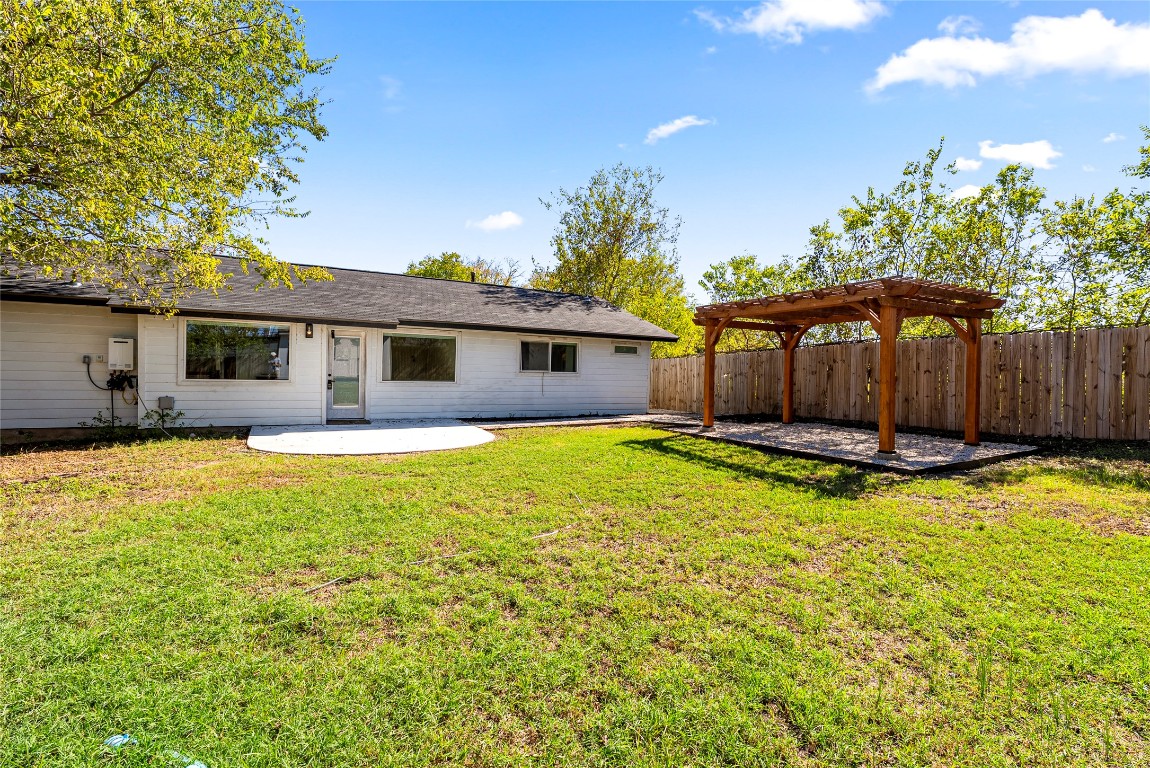 5200 King Charles Drive Austin, TX 78724 - Photo 20 of 22 Rear view of house with a patio area, a fenced backyard, and a pergola