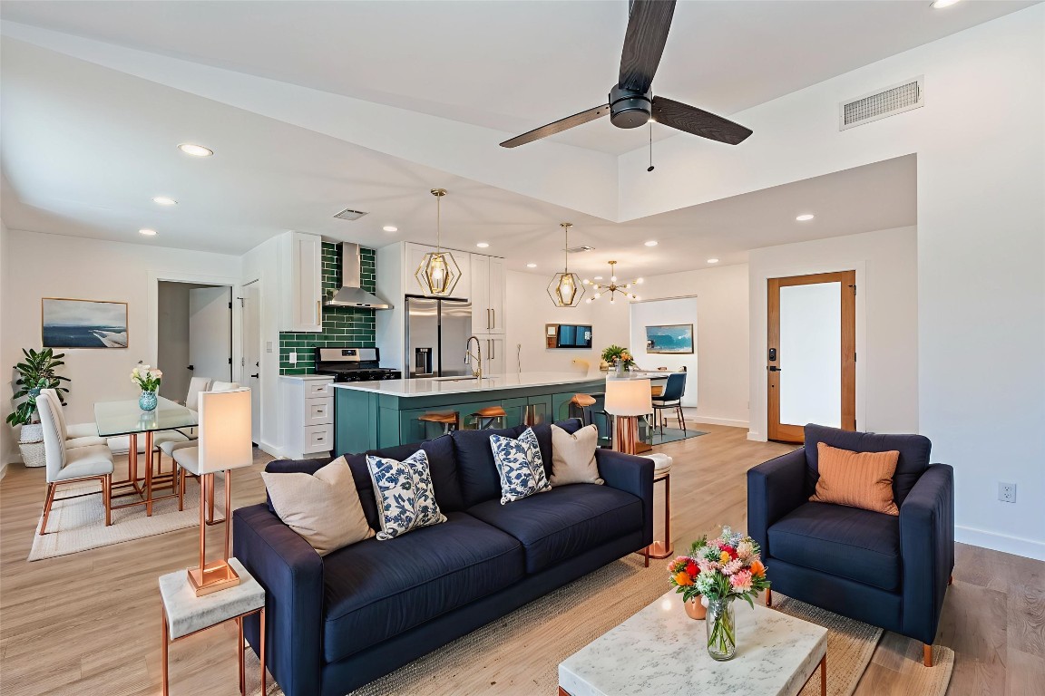 5200 King Charles Drive Austin, TX 78724 - Photo 4 of 22 Living room with recessed lighting, a chandelier, light wood-type flooring, and ceiling fan