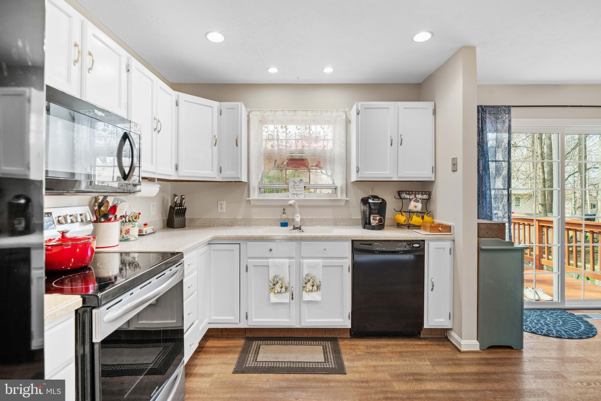11551 San Rafael Road Lusby, MD 20657 - Photo 2 of 31 a kitchen with stainless steel appliances granite countertop a stove a sink dishwasher and a refrigerator