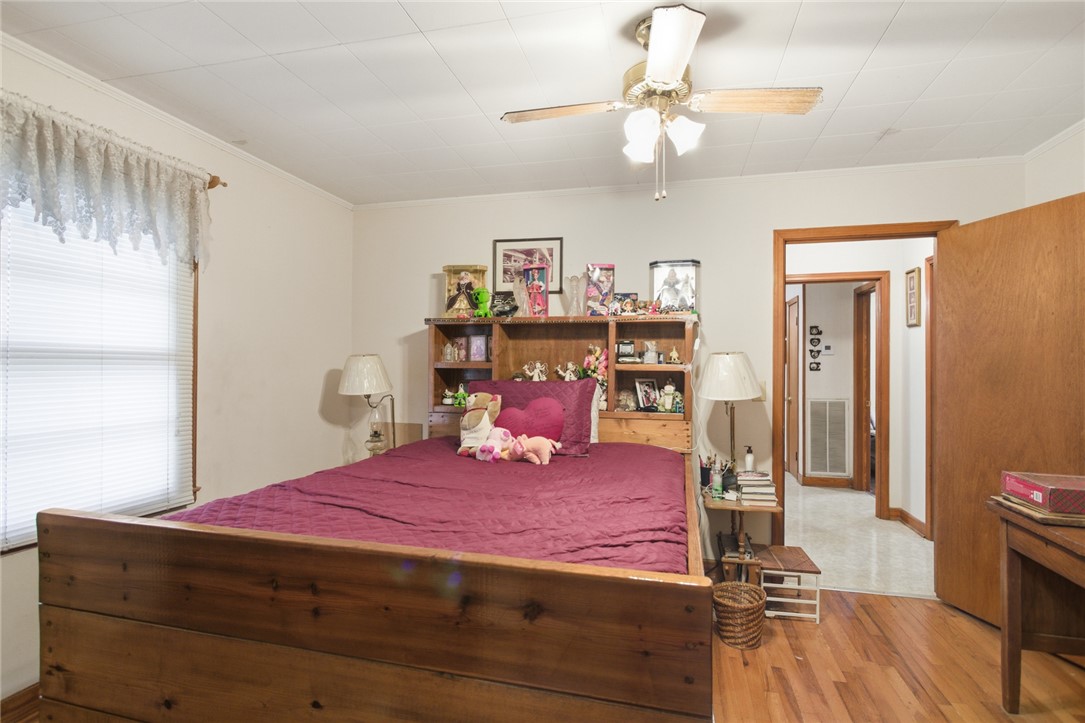 282 West Bennett Road Westminster, SC 29693 - Photo 22 of 42 This cozy bedroom features warm wood flooring and a refreshing ceiling fan for ultimate comfort.