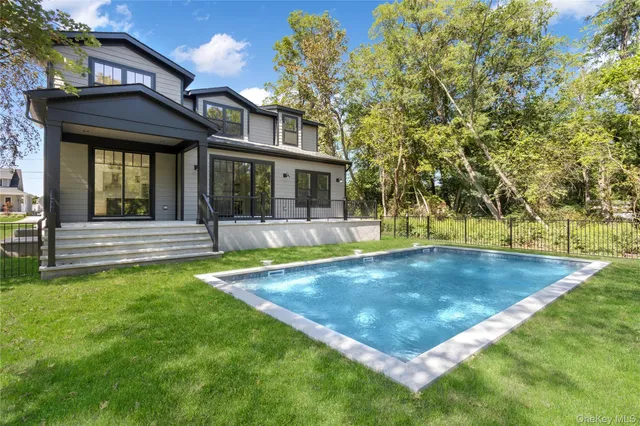 a view of a house with swimming pool
