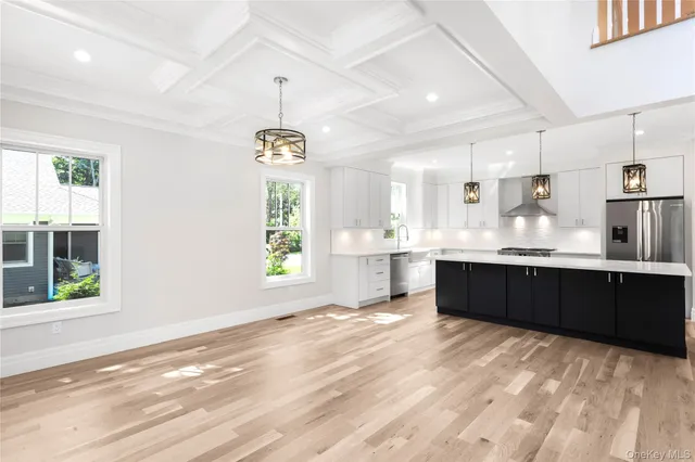 a large kitchen with kitchen island granite countertop a window