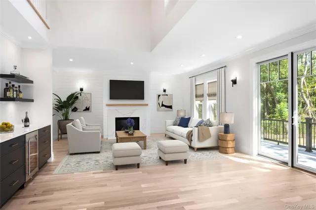 a view of a kitchen with wooden floor and windows