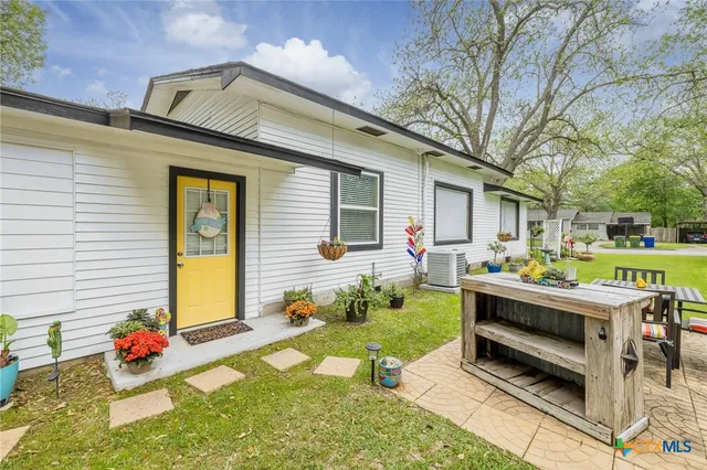 a front view of house with garden and patio