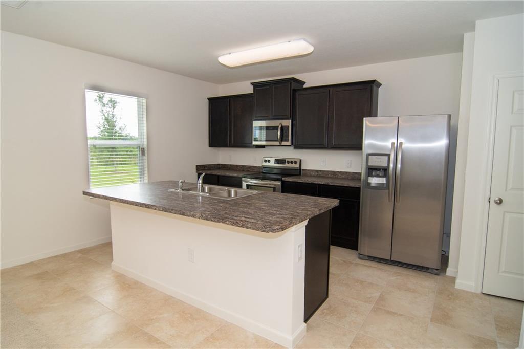 3116 Yellowstone Circle Fort Pierce, FL 34945 - Photo 4 of 10 YELLOWSTONE KITCHEN