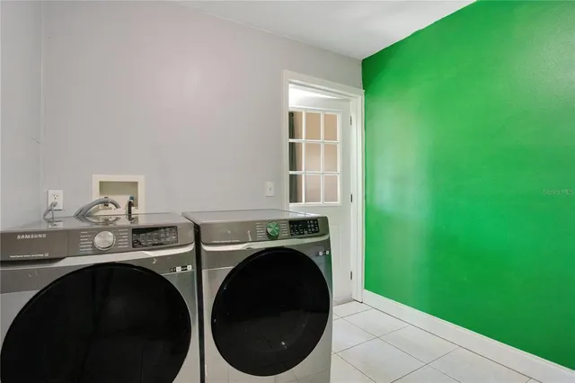 a utility room with dryer and washer