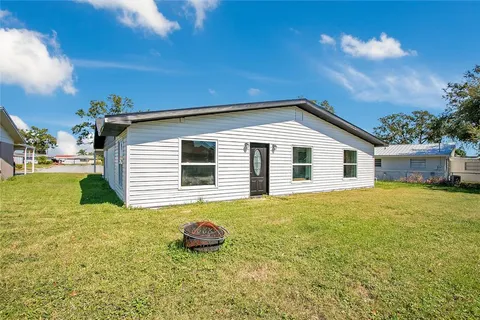 a house that has a large window in front of it