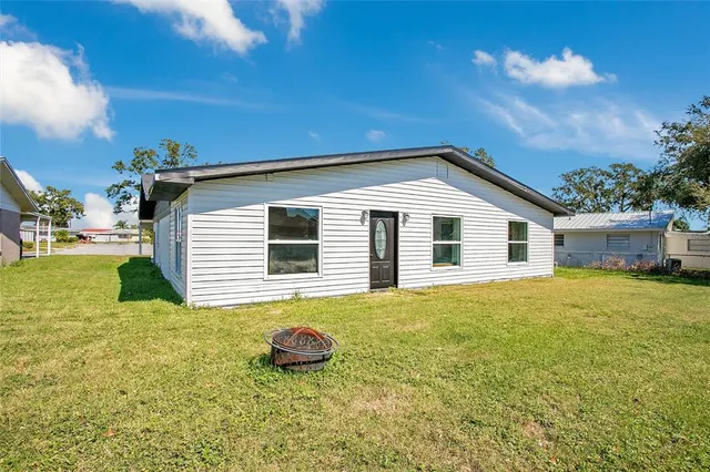 a house that has a large window in front of it