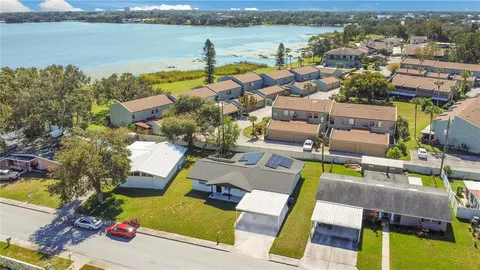 an aerial view of residential houses with yard