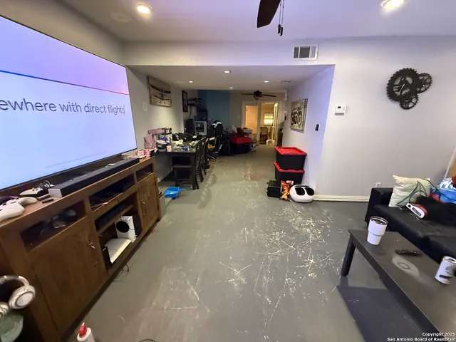 a room with gym equipment and a mirror