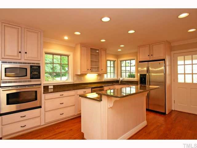 100 Byron Place Raleigh, NC 27609 - Photo 3 of 12 Kitchen has wonderful cabinets,granite counter tops and new stainless steel appliances. Kitchen