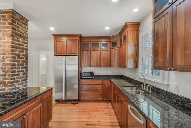 a white toilet sitting next to a bathroom sink