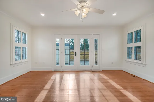 a view of a hallway with wooden floor